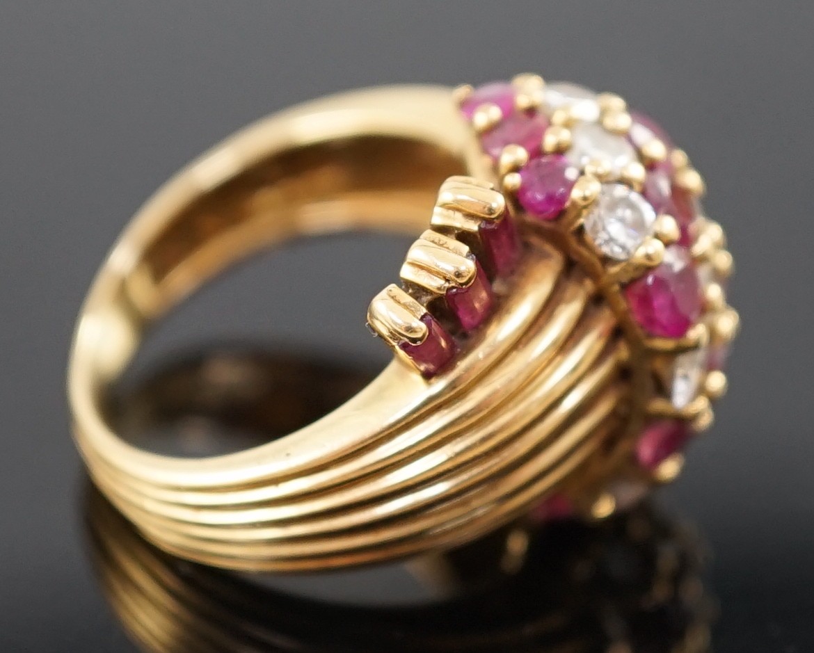 An early 1960's Kutchinsky 18ct gold ruby and diamond cluster set dress ring